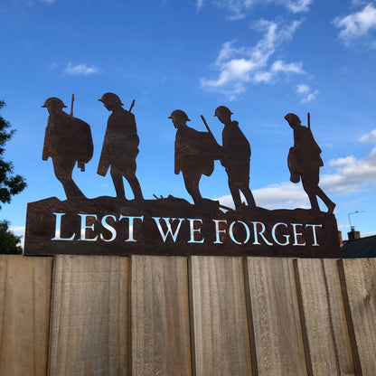 A Rusty Metal Lest We Forget Soldier Scene Garden Decoration