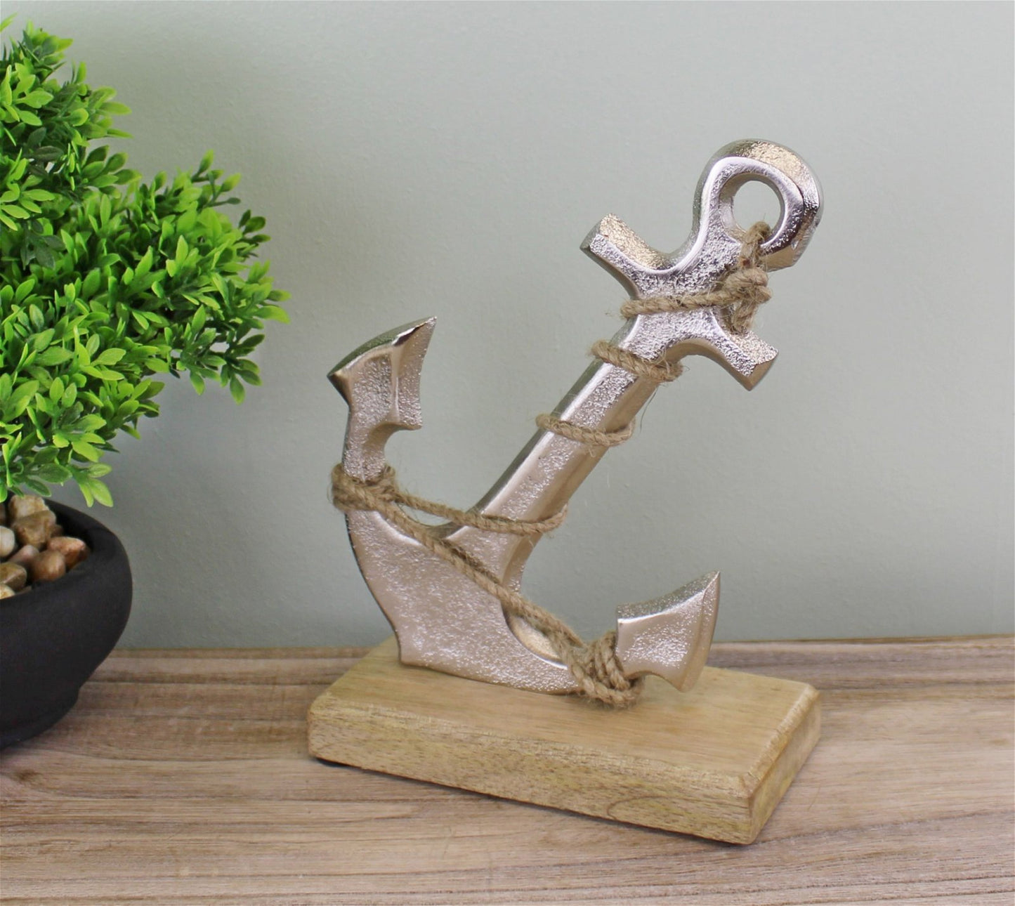 Silver Metal Anchor Ornament On Wooden Base